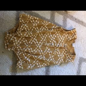 Mustard printed bubble body-suit. Kate Quinn